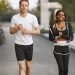 A man and woman jogging together outside, embracing a healthy lifestyle.